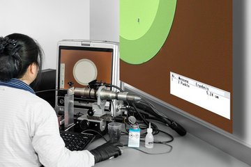 Fiber end face inspection with digital measuring microscope (magnification factor of 300)