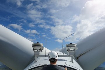 Technician in cell of wind turbine